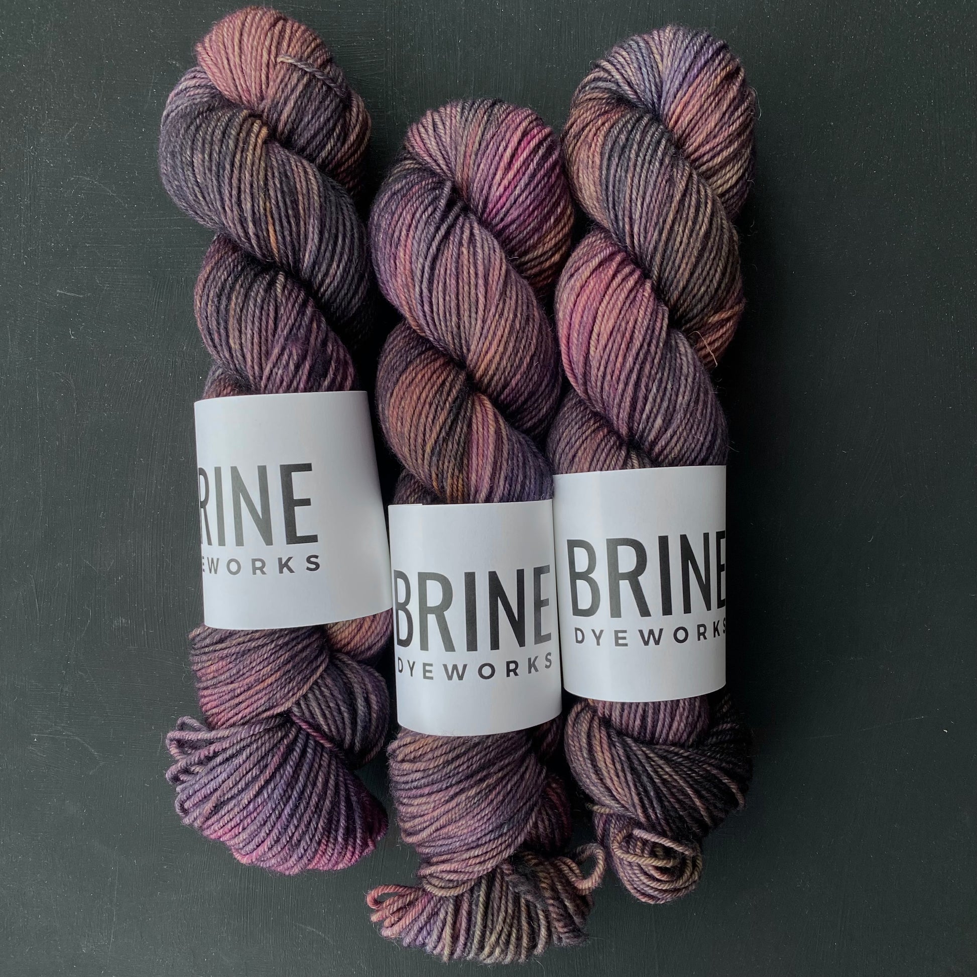 variegated purple yarn on a dark backdrop