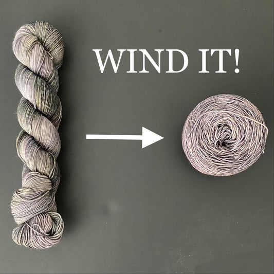 twisted skein of yarn with an arrow to indicate transformation into a cake of yarn. Text says "Wind it!"